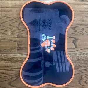 Titos dog food mat.